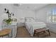 Cozy white bedroom with sink, bed and small bench at 1557 Kepley Dr, Mount Pleasant, SC 29464
