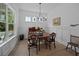 Elegant dining room with classic furnishings, decorative wainscoting, and ample natural light at 1557 Kepley Dr, Mount Pleasant, SC 29464
