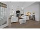 A bright living room with a fireplace, a view, and stylish, comfortable seating at 1557 Kepley Dr, Mount Pleasant, SC 29464