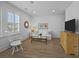 Bright living room with white sofa, neutral rug, wood floors, and stylish decor for a cozy and inviting atmosphere at 1557 Kepley Dr, Mount Pleasant, SC 29464
