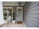 Inviting front porch featuring a rocking chair, elegant decor, and a tranquil spot to enjoy the outdoors at 1557 Kepley Dr, Mount Pleasant, SC 29464