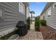 Side yard with grill, brick pavers, and landscaping at 1557 Kepley Dr, Mount Pleasant, SC 29464