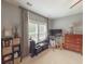Well-lit bedroom featuring neutral walls, a large window and tasteful decorations on display shelves at 157 Village Ponds Dr, Summerville, SC 29483