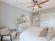 Bright bedroom featuring neutral walls, white dresser with mirror, and a cozy chair at 157 Village Ponds Dr, Summerville, SC 29483