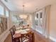 Dining room with hardwood floors, decorative light fixture, and natural light at 157 Village Ponds Dr, Summerville, SC 29483