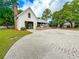 Community pavilion exterior with brick fireplace, grilling area, and outdoor seating overlooking the yard at 157 Village Ponds Dr, Summerville, SC 29483