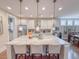 Beautiful kitchen island with counter seating, pendant lights and granite countertops at 157 Village Ponds Dr, Summerville, SC 29483