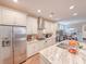 Bright, modern kitchen features stainless appliances, granite countertops, and recessed lighting at 157 Village Ponds Dr, Summerville, SC 29483