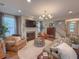Well-lit living room boasting hardwood floors and comfortable seating around a central coffee table at 157 Village Ponds Dr, Summerville, SC 29483