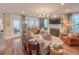 Inviting living room featuring a fireplace, hardwood floors, and plenty of natural light at 157 Village Ponds Dr, Summerville, SC 29483