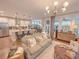 Open concept living room showcasing a view to the kitchen with stainless appliances and breakfast bar at 157 Village Ponds Dr, Summerville, SC 29483