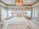 This beautiful Primary bedroom offers a bright space, decorative lighting, and neutral color palette at 157 Village Ponds Dr, Summerville, SC 29483