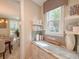 Pantry with granite countertop, open shelving, and natural light from the window at 157 Village Ponds Dr, Summerville, SC 29483
