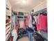 Bright, organized walk-in closet provides ample storage space and custom shelving at 157 Village Ponds Dr, Summerville, SC 29483