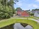 Aerial view of the backyard showing the property line and a small pond at 1576 Nautical Chart Dr, Charleston, SC 29414