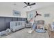Stylishly decorated Bedroom featuring unique wall accents, a ceiling fan, and plenty of space to play at 1576 Nautical Chart Dr, Charleston, SC 29414