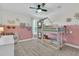 Charming bedroom with playful wall design, bunk beds, ceiling fan, and ample natural light at 1576 Nautical Chart Dr, Charleston, SC 29414