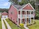 Charming two-story home featuring a double stacked front porch and a detached garage at 1576 Nautical Chart Dr, Charleston, SC 29414