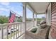 Welcoming front porch offering comfortable seating, perfect for enjoying the neighborhood ambiance and fresh air at 1576 Nautical Chart Dr, Charleston, SC 29414
