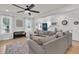 Bright and spacious living room with hardwood floors, large sectional, and natural light at 1576 Nautical Chart Dr, Charleston, SC 29414