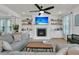 Inviting living room features a fireplace with TV above and custom built-ins for ample storage at 1576 Nautical Chart Dr, Charleston, SC 29414