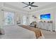 Airy main bedroom featuring ample natural light, a cozy seating area, and elegant decor for a peaceful retreat at 1576 Nautical Chart Dr, Charleston, SC 29414