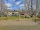 Community playground with two wooden swingsets, offering outdoor fun for residents at 1576 Nautical Chart Dr, Charleston, SC 29414