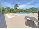 Community swimming pool with a splash area, clear blue water, palm trees, and lounge area at 1576 Nautical Chart Dr, Charleston, SC 29414