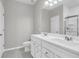 Bathroom featuring double sinks, white cabinetry, and a glass-enclosed shower at 158 Hayworth Rd, Summerville, SC 29486
