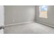 Empty carpeted bedroom with a single window providing natural light at 158 Hayworth Rd, Summerville, SC 29486