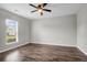 Bright room with hardwood floors, a ceiling fan, and a window overlooking the neighborhood at 158 Hayworth Rd, Summerville, SC 29486
