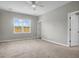 Bright carpeted bedroom featuring a large window and a neutral color palette at 158 Hayworth Rd, Summerville, SC 29486