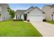Charming single-Gathering home with a well-manicured lawn and a two-car garage in a suburban neighborhood at 158 Hayworth Rd, Summerville, SC 29486