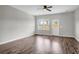 Living room with vinyl floors, a ceiling fan, white trim, and a view of the backyard at 158 Hayworth Rd, Summerville, SC 29486