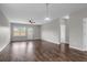 Open-concept living area with hard surface floors, ceiling fan, and access to the backyard at 158 Hayworth Rd, Summerville, SC 29486