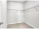 Empty walk-in closet featuring wire shelving and neutral carpeting at 158 Hayworth Rd, Summerville, SC 29486
