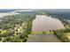 Wide aerial shot showcasing lush greenery, a serene lake, and charming homes nestled within a picturesque neighborhood at 1607 Waterside Blvd, Moncks Corner, SC 29461