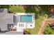 Aerial view of a backyard pool and patio with stylish lounge seating, surrounded by lush landscaping and greenery at 1607 Waterside Blvd, Moncks Corner, SC 29461