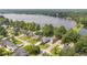 Aerial view of a charming neighborhood with lush trees and a view of a beautiful lake at 1607 Waterside Blvd, Moncks Corner, SC 29461