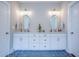 Bathroom featuring double sinks, white cabinets, and oval mirrors at 1607 Waterside Blvd, Moncks Corner, SC 29461