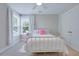 Cozy bedroom with a ceiling fan, window, and pink accents at 1607 Waterside Blvd, Moncks Corner, SC 29461