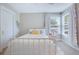 Cozy bedroom featuring a white bed, natural light from the window, and a calming color palette at 1607 Waterside Blvd, Moncks Corner, SC 29461