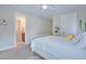 Bedroom with a white bed, plush pillows, and an open doorway to the ensuite bathroom at 1607 Waterside Blvd, Moncks Corner, SC 29461