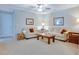Cozy living room with soft, neutral decor, comfortable seating, and a ceiling fan for added comfort at 1607 Waterside Blvd, Moncks Corner, SC 29461
