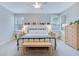 Comfortable main bedroom with a ceiling fan, bench, and natural light at 1607 Waterside Blvd, Moncks Corner, SC 29461