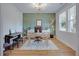 Well-lit office featuring a large window, modern desk, and charming decor for an inspiring work environment at 1607 Waterside Blvd, Moncks Corner, SC 29461