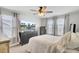 Bright bedroom with natural light from windows, a ceiling fan, and a neutral color scheme at 1634 Eider Down Dr, Summerville, SC 29483
