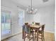 Cozy dining area with natural light, modern chandelier, and seating for four at 1634 Eider Down Dr, Summerville, SC 29483