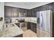 Kitchen with dark cabinets, stainless steel appliances, and granite countertops at 1634 Eider Down Dr, Summerville, SC 29483