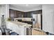Kitchen with dark cabinets, stainless steel appliances, and granite countertops at 1634 Eider Down Dr, Summerville, SC 29483